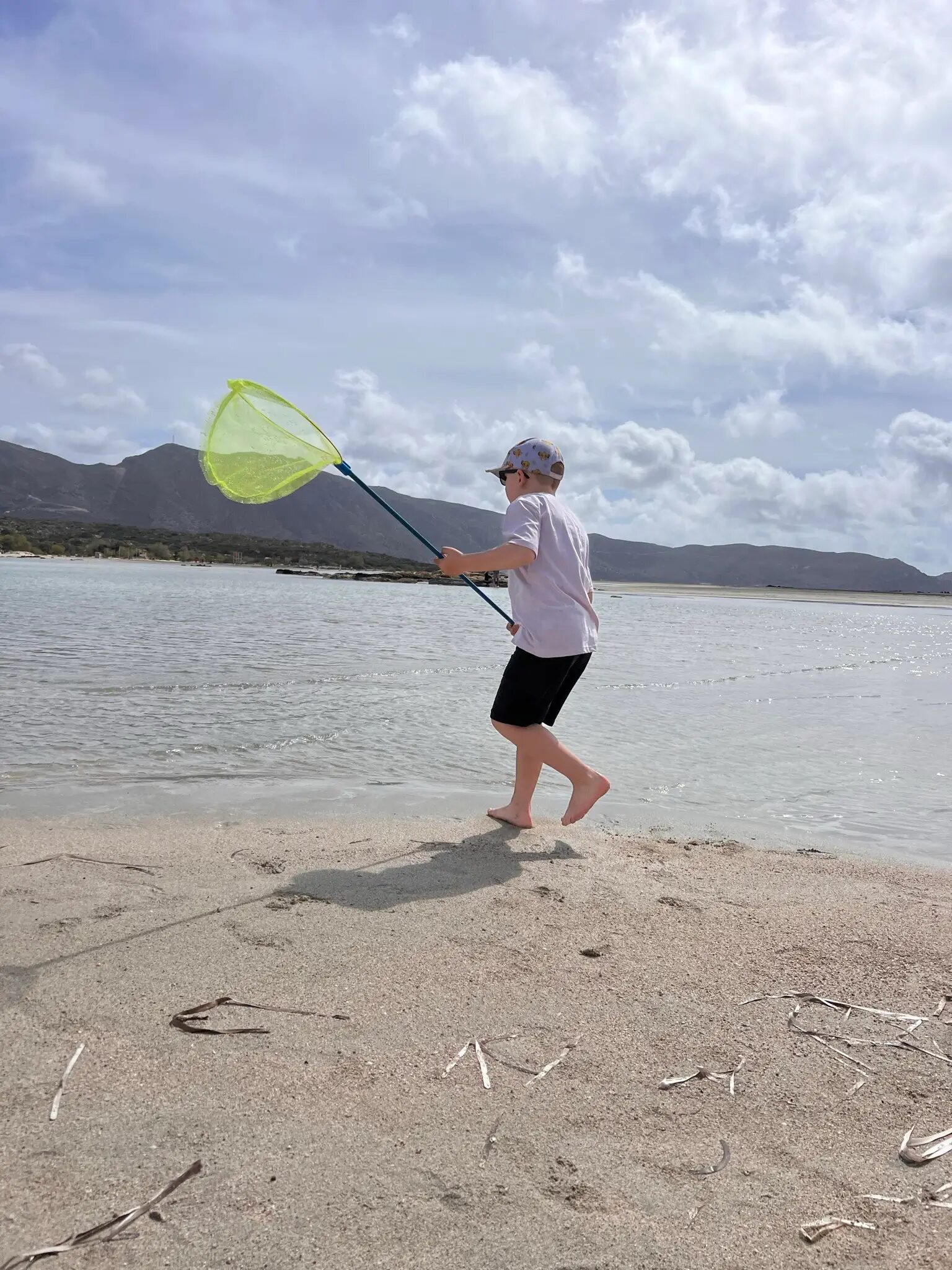 kid plays on a beach in Crete | CreteLocals